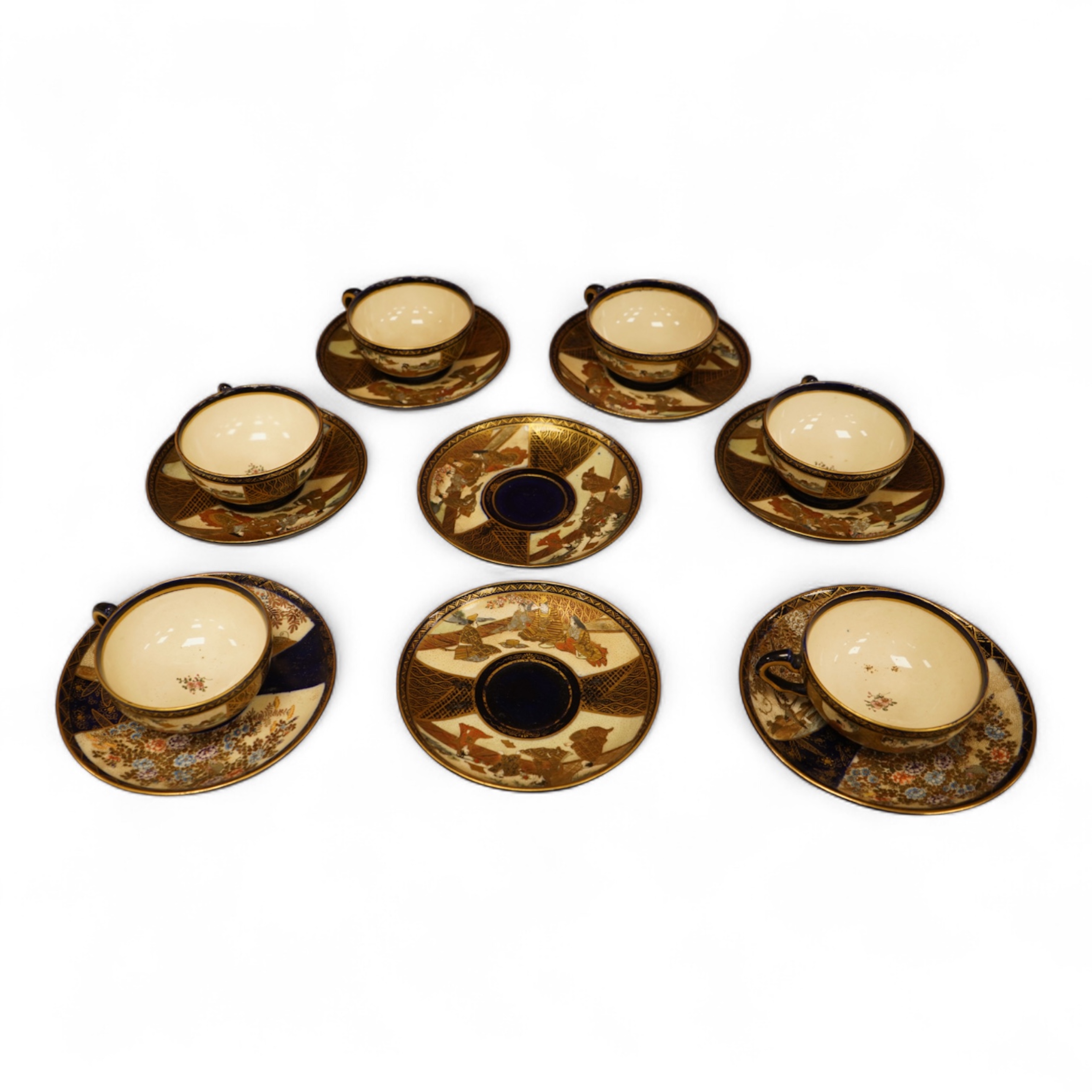 A set of six Japanese Satsuma pottery teacups and saucers, and two further saucers
